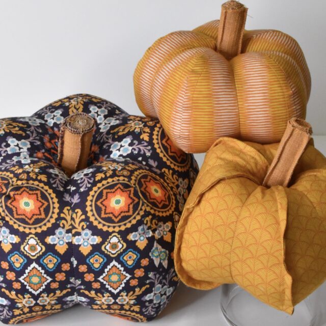 three fabric pumpkins