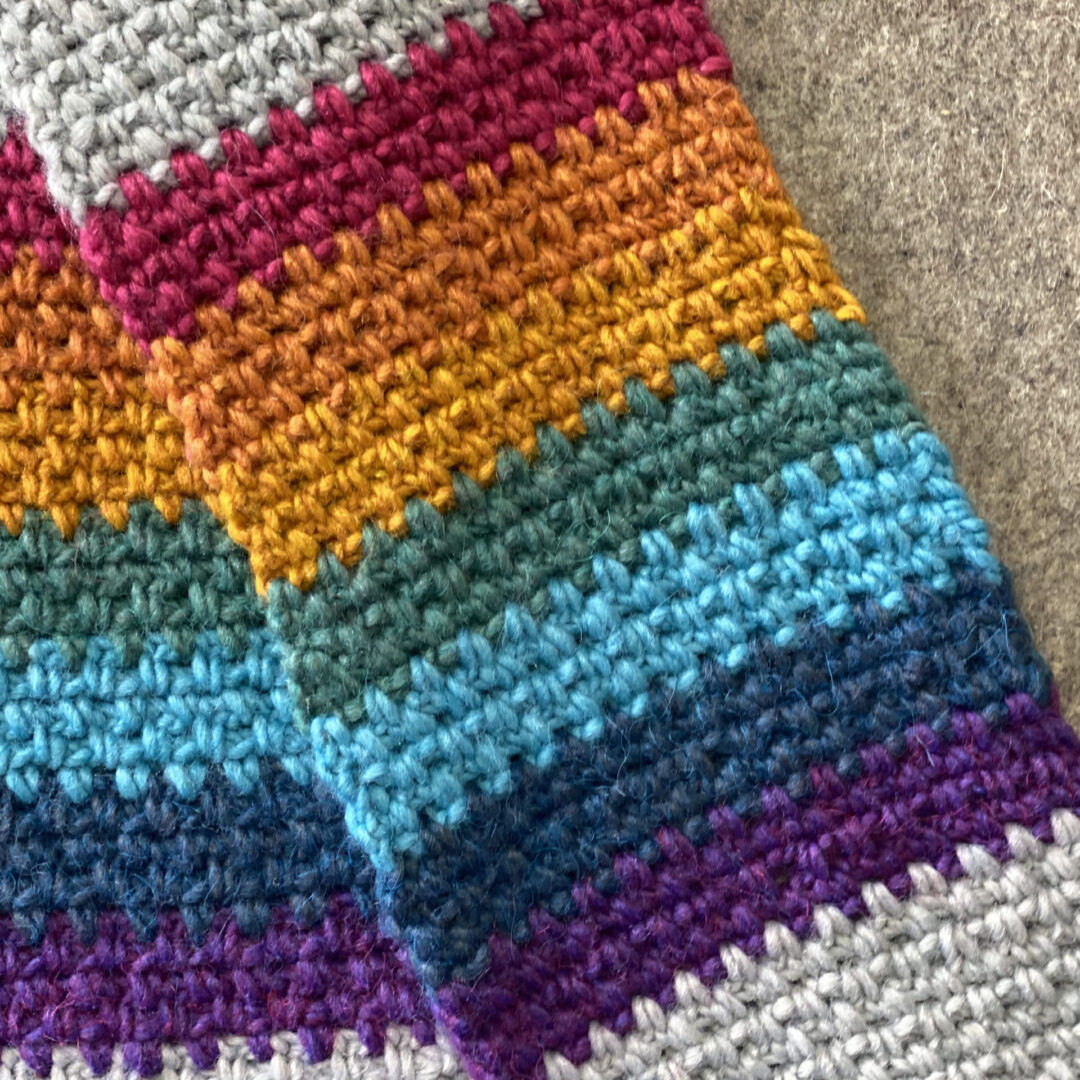 A Colorful crochet on a brown background